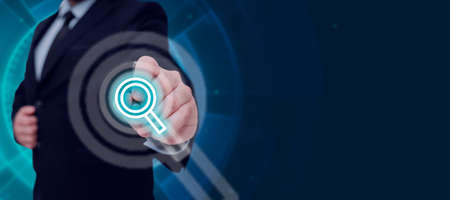 Businessman Holding A Tablet And Projecting A Camera In A Graphic Hexagone Design. Man In A Necktie Presenting Creative Photography And Digital Information.の写真素材