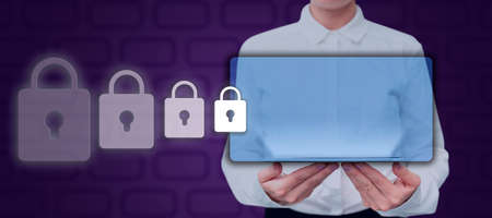Businesswoman Holding Tablet Presenting Digitally Generated Display And Padlocks. Elegant Woman With...