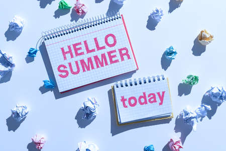 Text showing inspiration Hello Summer. Business showcase Welcoming the warmest season of the year comes after spring Notebooks With Important Messages Surrounded By Paper Wraps.の写真素材