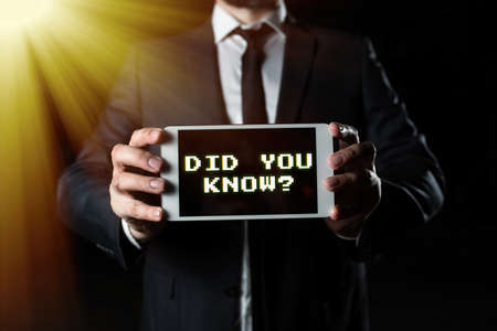 Conceptual display Did You Know. Business concept Knowing the next move Thinking Trivia Brainstorming Wondering Businessman Presenting Important Informations On Phone Screen.の写真素材