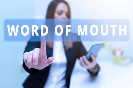 Text sign showing Word Of Mouth. Business idea Oral spreading of information Storytelling Viva Voice Woman Holding Tablet With One Hand And Pointing New Ideas With One Finger.の写真素材