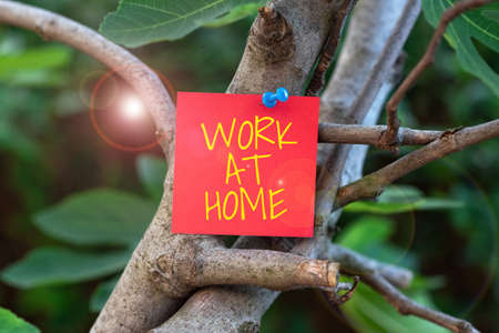 Hand writing sign Work At Home. Business idea Freelance job working on your house convenient...