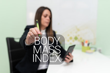 Text sign showing Body Mass Index. Conceptual photo Value derived from the weight and height of an individual Businesswoman Having Tablet On Desk And Pointing New Ideas With Pen.の写真素材