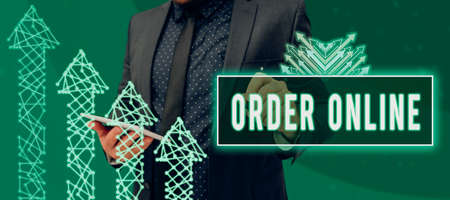 Writing displaying text Order Online. Internet Concept Buying goods and services from the sellers over the internet Businessman Drawing Business Graph And Presenting Ideas For Progress.の写真素材