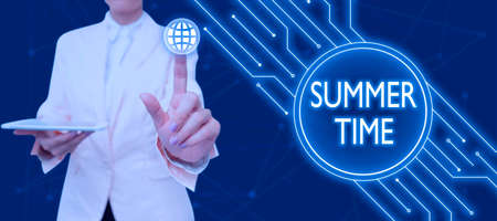 Text showing inspiration Summer Time. Word Written on Longer daylight Tropical season Beach activities Vacation Businessman in suit holding open palm symbolizing successful teamwork.の写真素材