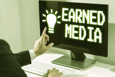 Writing displaying text Earned Media. Word for Publicity gained through promotional efforts by...