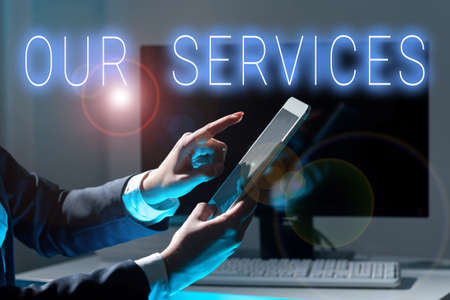 Handwriting text Our Services. Word for The occupation or function of serving Intangible products Businesswoman Holding Tablet And Pointing With One Finger On Important Newsの写真素材