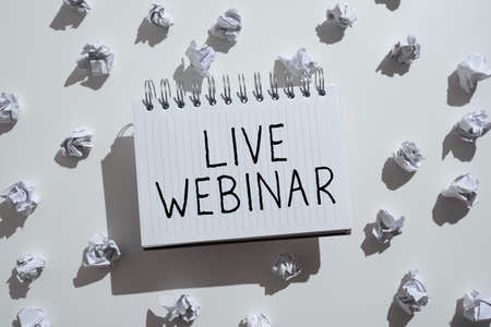 Writing displaying text Live Webinar. Concept meaning Interactive seminar transmitted over the web Real Time Notepad With Important Informations Surrounden By Paper Wraps.の写真素材