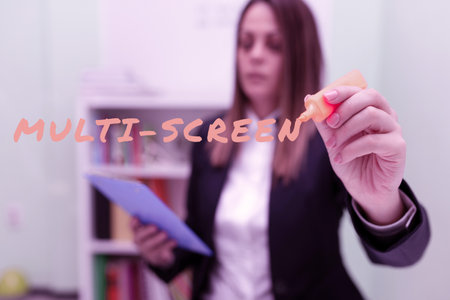 Conceptual caption Multi Screen. Business idea Having or involving several screen especially in a cinema Woman Holding Clipboard In One Hand And Marker With Other Pointing New Ideaの写真素材