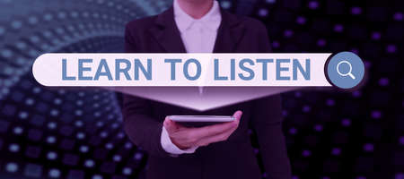 Conceptual caption Learn To Listen. Business showcase Able to understand what showing tells you be respectful Businessman in suit holding open palm symbolizing successful teamwork.の写真素材