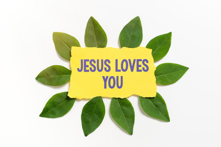 Inspiration showing sign Jesus Loves You. Business overview Believe in the Lord To have faith religious person Blank Color Paper Surrounded With Leaves For Invitation Card.の写真素材