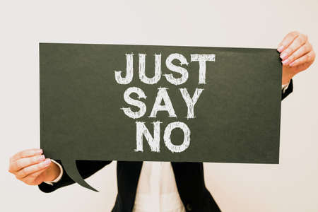 Text showing inspiration Just Say No. Business approach Do not be afraid of giving negative answers to some things Businesswoman Holding Speech Bubble With Important Messages.の写真素材
