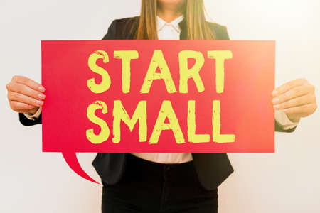 Text showing inspiration Start Small. Conceptual photo Small medium enterprises start up Business entrepreneurship Businesswoman Holding Speech Bubble With Important Messages.の写真素材