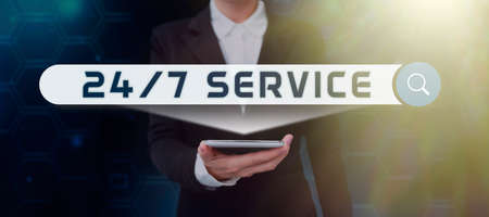 Text caption presenting 24 7 Service. Business approach Always available to serve Runs constantly without disruption Businessman in suit holding tablet symbolizing successful teamwork.の写真素材