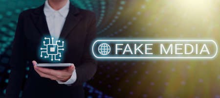 Hand writing sign Fake Media. Business overview An formation held by brodcasters which we cannot rely on Businessman in suit holding open palm symbolizing successful teamwork.の写真素材