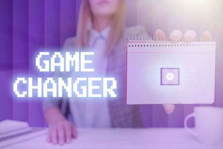 Text caption presenting Game Changer. Business approach Sports Data Scorekeeper Gamestreams Live Scores Team Admins Lady Pressing Screen Of Mobile Phone Showing The Futuristic Technologyの写真素材