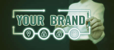 Text caption presenting Your Brand. Business showcase A name of any kind that is impacted to something as trademark Lady in suit holding pen symbolizing successful teamwork accomplishments.の写真素材