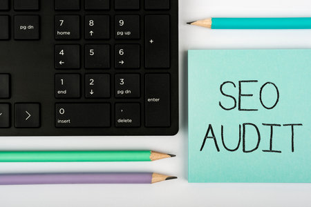 Handwriting text Seo Audit. Concept meaning Search Engine Optimization validating and verifying process Computer Keyboard And Symbol.Information Medium For Communication.の写真素材