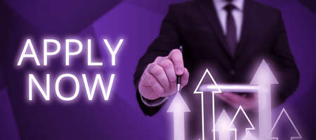 Writing displaying text Apply Now. Business showcase An act of a person to acquire the job related to the profession Businessman in suit holding open palm symbolizing successful teamwork.の写真素材