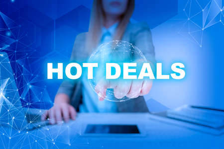 Inspiration showing sign Hot Deals. Concept meaning An agreement through which one of the paties is offered and accept Lady in suit pointing finger represents global innovative thinking.の写真素材