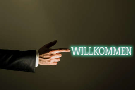 Writing displaying text Willkommen. Word for welcoming showing event or your home something to that effect -47342の写真素材