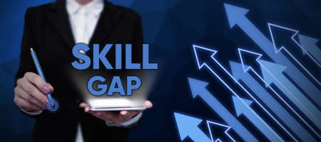 Conceptual caption Skill Gap. Business approach Refering to a person s is weakness or limitation of knowlege Lady in suit holding pen symbolizing successful teamwork accomplishments.の写真素材