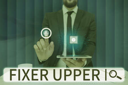 Text caption presenting Fixer Upper. Internet Concept house in need of repairs used chiefly...