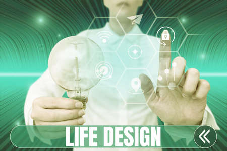 Conceptual caption Life Design. Business showcase balance how you live between work family and entertaining Lady holding light bulb pointing finger upwards symbolizing success.の写真素材