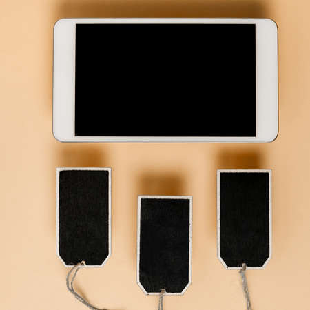 Tablet With Important Message Over Marker, Clipboard And Piece Of Paper. Mobile Phone Screen With Crutial Information Above Notes. Presented Critical Updates On Cellphone.の写真素材