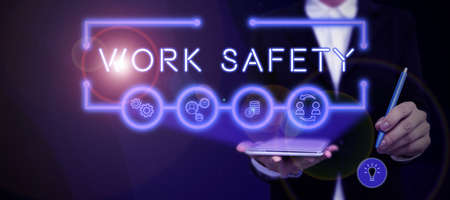Handwriting text Work Safety. Business showcase Policies and control in place according to government standard Lady in suit holding pen symbolizing successful teamwork accomplishments.の写真素材