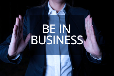 Conceptual caption Be In Business. Business overview Working at this moment Executing professional work right now Man pointing finger holding trophy cheering reaching project success.の写真素材