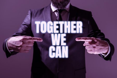 Sign displaying Together We Can. Word Written on Unity can makes everything possible One powerful group Man Holding Digital Display Futuristic Technology Computer Systemの写真素材