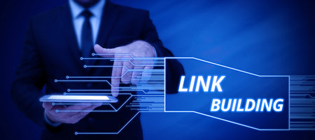 Hand writing sign Link Building. Business approach Process of acquiring hyperlinks from other websites Connection Businessman in suit holding notepad symbolizing successful teamwork.の写真素材