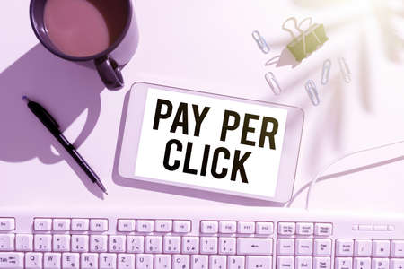 Text showing inspiration Pay Per Click. Business overview Internet Advertising Model Search Engine marketing Strategy Frame Decorated With Colorful Flowers And Foliage Arranged Harmoniously.の写真素材