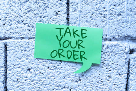 Handwriting text Take Your Order. Business idea Service in a restaurant cafe or any other food place Businessman in suit holding open palm symbolizing successful teamwork.の写真素材