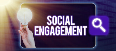 Handwriting text Social EngagementDegree of engagement in an online community or society. Concept meaning Degree of engagement in an online community or societyの写真素材