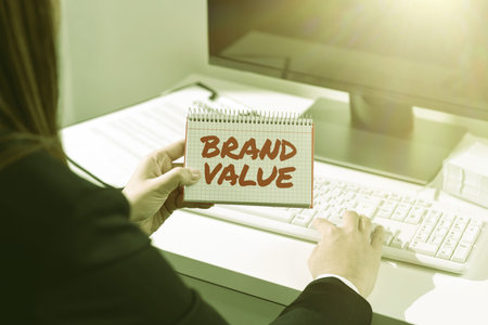 Hand writing sign Brand Value. Conceptual photo company generates from product with recognizable for its namesの写真素材