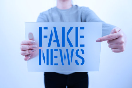 Conceptual caption Fake News. Business idea Giving information to showing that is not true by the mediaの写真素材