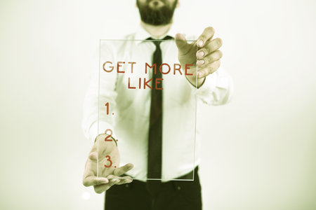 Sign displaying Get More Like. Internet Concept Thumbs up Hashtags Page Plugin Approvals Followersの写真素材