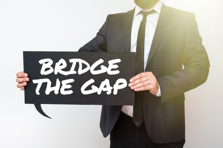 Writing displaying text Bridge The Gap. Concept meaning Overcome the obstacles Challenge Courage Empowermentの写真素材