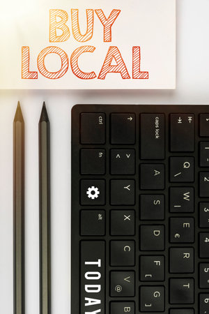 Hand writing sign Buy Local. Business concept Patronizing products that   made originally or nativeの写真素材