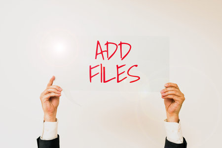 Sign displaying Add Files. Business idea To put more information to a certain person,thing,or documentの写真素材