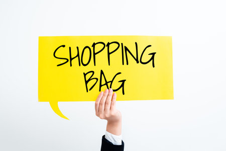 Sign displaying Shopping Bag. Concept meaning Containers for carrying personal possessions or purchasesの写真素材