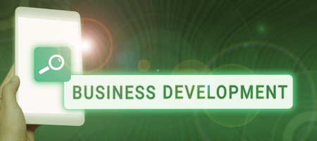 Handwriting text Business Development. Word Written on Implement Growth Value within and between companyの写真素材