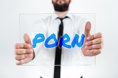 Conceptual caption Porn. Business idea depiction of erotic behavior intended to cause sexual excitementの写真素材