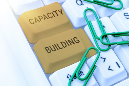Writing displaying text Capacity Building. Business idea process by which individuals gain knowledge and skillsの写真素材