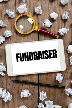 Text caption presenting Fundraiser. Business idea person whose job or task is seek financial support for charityの写真素材