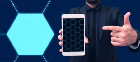 Man Standing Holding Tablet And Pressing On Virtual Graph. Business Man Carrying Pad Tapping Switch Showing New Futuristic Technologies.の写真素材