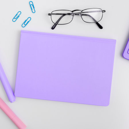 Office Supplies Over Desk With Keyboard And Glasses And Coffee Cup For Working Remotely, Assorted School Utilities For Studying With Hot Drink And Eyeglasses.の写真素材