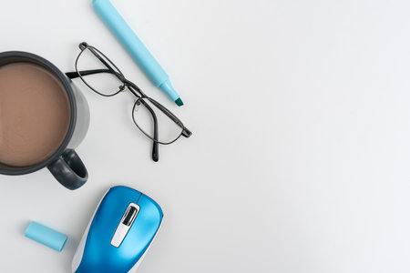 Office Supplies Over Desk With Keyboard And Glasses And Coffee Cup For Working Remotely, Assorted...
